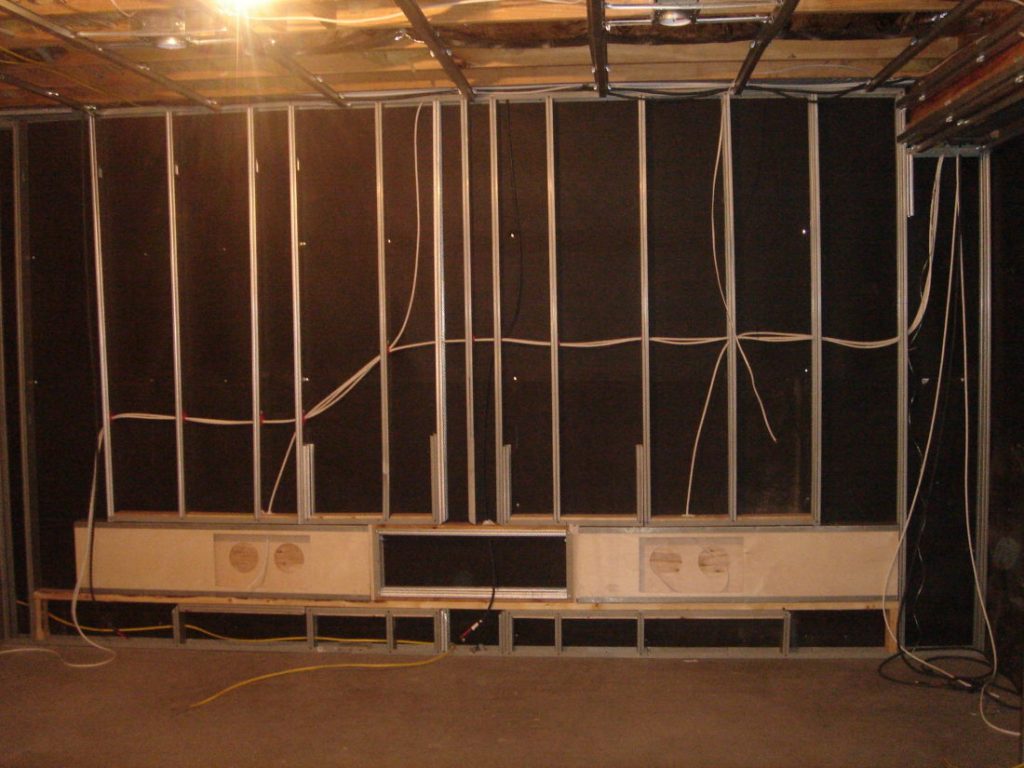 Sound deadening behind metal studs: 1/4" thick MLV layer can equal 12" of poured concrete for sound deadening!